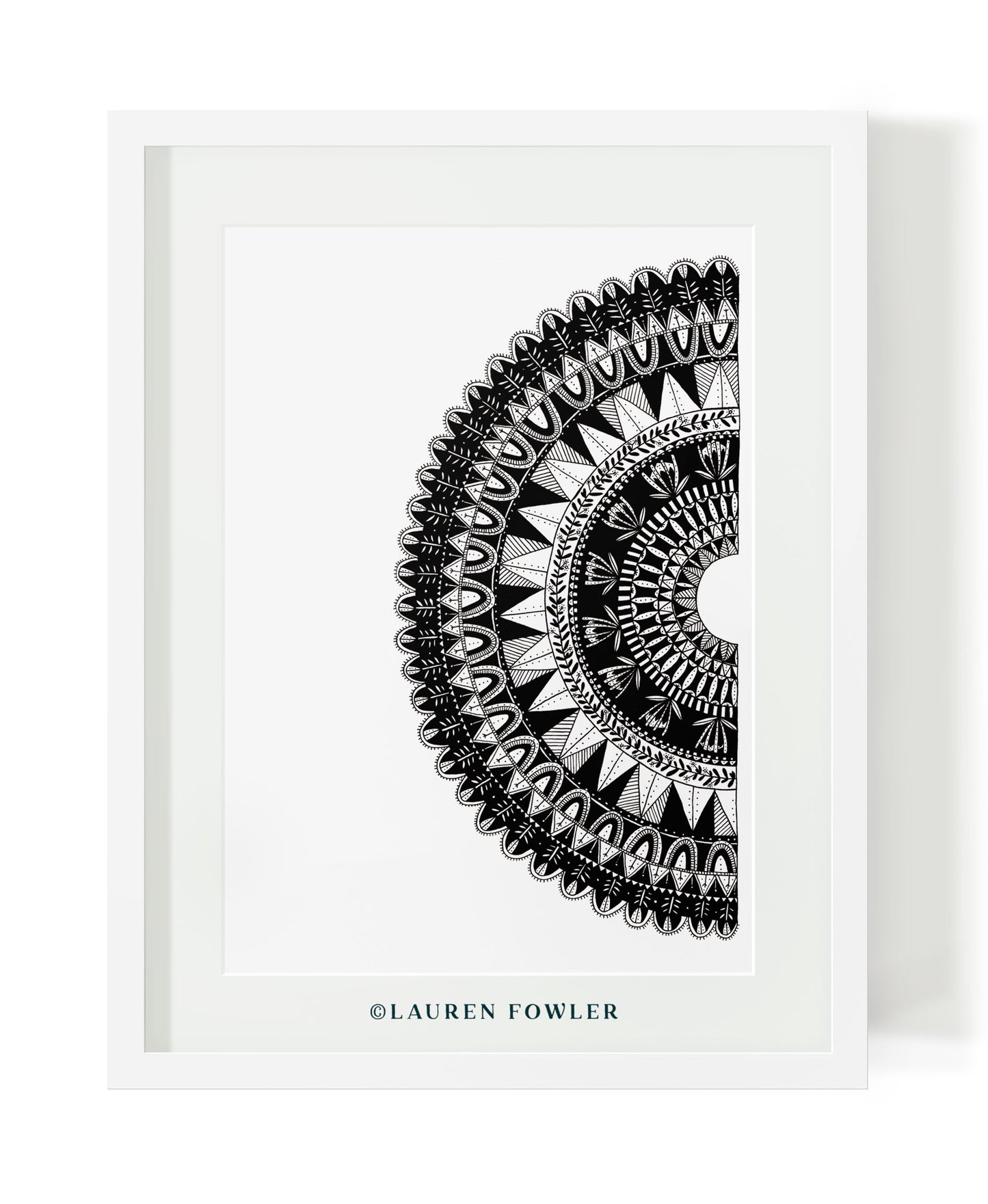 Black and white half mandala illustrated artwork by Lauren Fowler